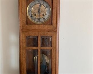#17	Oak Antique Clock w/brass engraved Face &  Pendulum w/key  E N Wilch - as is missing piece  10x5x27	 $175.00 

