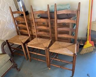 #100	(3) Ladder Back chairs w/rushing seats - sold as a set	 $75.00 
