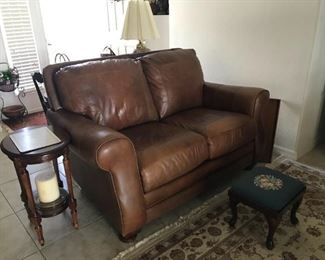 Caramel brown colored genuine leather loveseat in perfect condition. Measures 56" x 35" x 36".  $1200 for the pair
