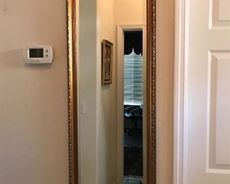 Gold tone rectangular mirror, 16.5" x 43"