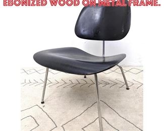 Lot 2319 Eames DCM Chair. Ebonized wood on metal frame.