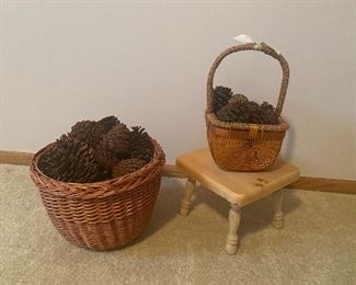 Wicker baskets filled with pine cones, wood step stool