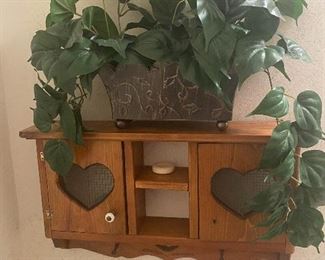 Oak wall cabinet, fake plant