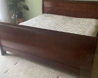 King size sleigh bed, framed wall art, fake plant