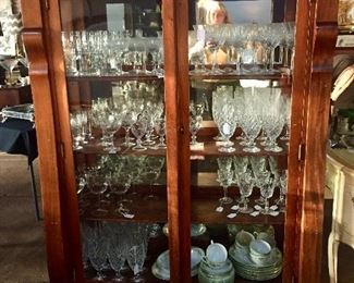 Circa 1900 mirrored back china cabinet with all sorts of crystal