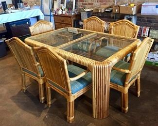Glass topped rattan dining table and six chairs
