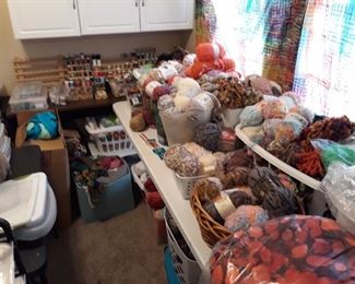 Bin after bin of all types of yarn. Most of them are new reams.