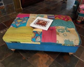Custom upholstered ottoman.