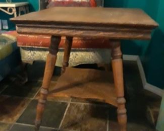 Victorian parlor table with ball and claw feet.
