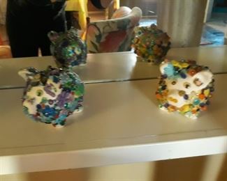 Handmade jeweled piggy banks.
