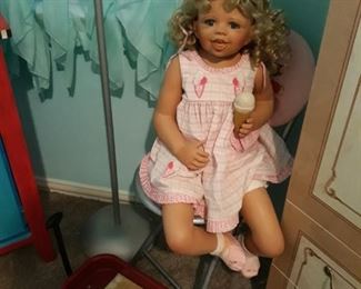 Little red wagon, and porcelain doll.