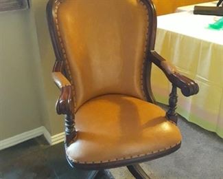 Leather and wood swivel chair. Very heavy and sturdy.