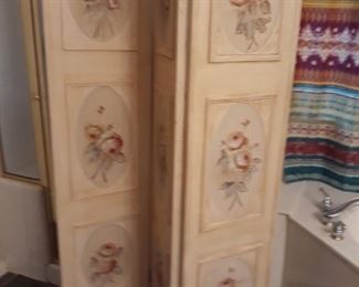 Painted wood privacy screen.