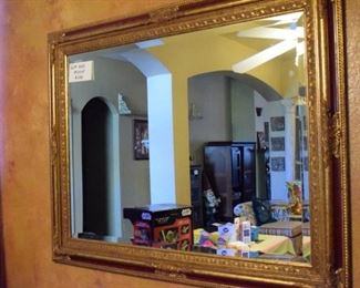 Large gilt and wood mirror.