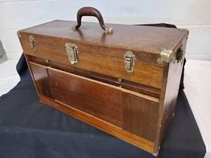 Antique Workmans Tool Box with  11 drawers.. The missing front panel piece is with the tool box, just needs to be fixed.