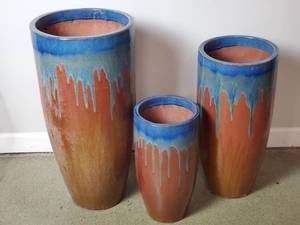 Set of (3) Clay Pottery Planters.

1-15" W x 32" H

1-12" W x 26" H

1-10" W x 19" H