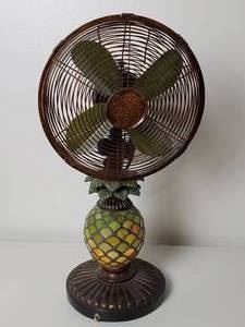Decorative Oscillating Table Fan with Light up Base, tested & works.  Stay cool and comfortable while having a fun lamp! 