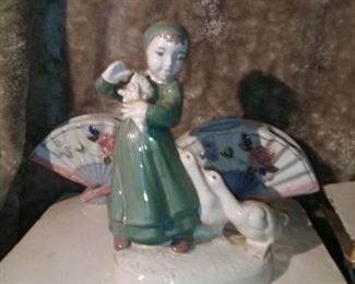 miniature vase and porcelain doll