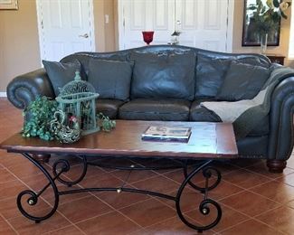 Sage leather sofa and coffee table. There are two sofas.