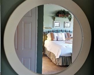 Very large round white mirror