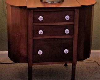 Antique sewing chest. Side open. Women would put their knitting needles and yarn in these chests.