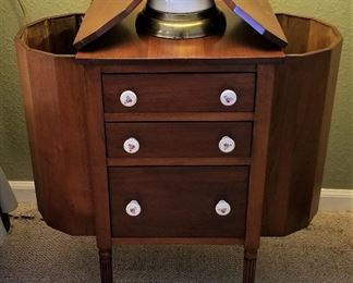 Antique sewing chest. Side open. Women would put their knitting needles and yarn in these chests.