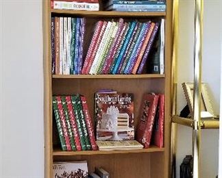 Tall bookshelves and lots of cookbooks. 