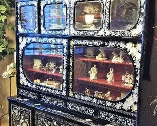  Oriental black lacquer mother of pearl inlay china cabinet. There are all kinds of oriental figurines and traditional items too.