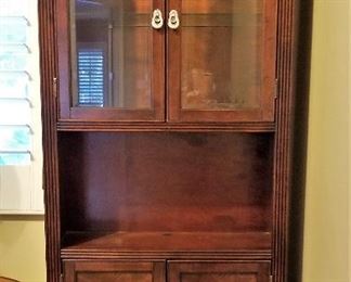 Display cabinet with glass and storage. There are 2 matching. These were used in an office.