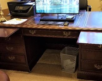 Office desk with pull out trays.