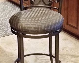 There are 2 metal bar stools.