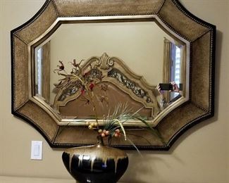 3 dimensional curved framed mirror.