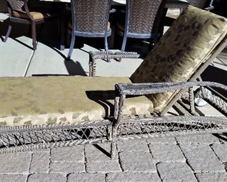 We have 2 matching wicker chaise lounge chairs with wheels.