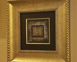 Gold framed art.