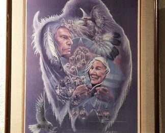 Native American art with eagles flying and feathers and male and female elders.