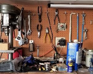 Lots of tools. We have a drill press and band saw and table saw etc...