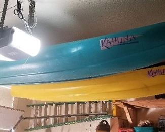 Blue kayak and a yellow kayak for sale.