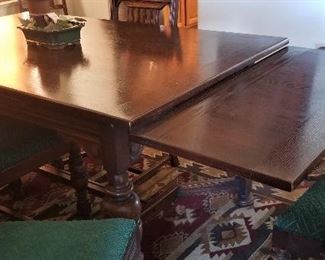 Antique table that is so beautiful. The sides pull out to extend table. There are 6 chairs.