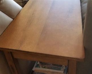 Triangle wood table for a small space or next to a bed or reading chair.