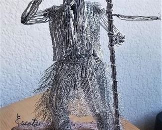 Now this is a cool piece. Wire mesh sculpture of a Native American on a rock.