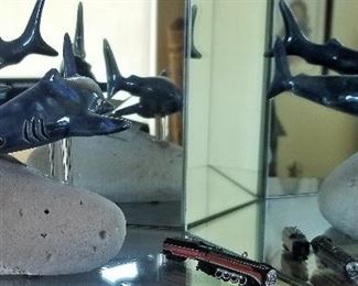 Dolphins on a rock sculpture.