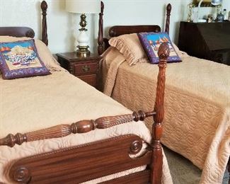 Antique twin beds and comforters.