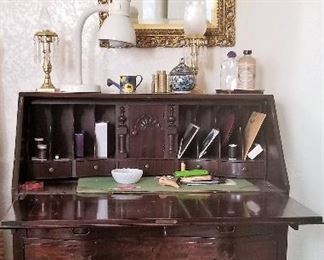 Antique writing desk with hidden compartments.