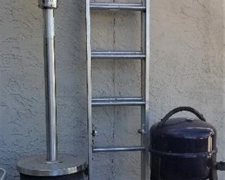 Outdoor heaters and extension ladder.