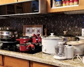 Lots of kitchen items including small appliances.