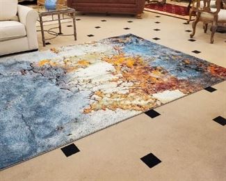 This beautiful large area rug has never been used. We literally opened the sealed package it came in. BRAND NEW.
