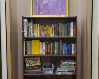 Books! Adult and childrens. Also some very nice, unique bookends. That's a magazine rack on the left side!