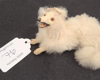 antique white fur dog with bone teeth