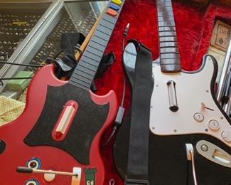 another fender guitar and a toy guitar