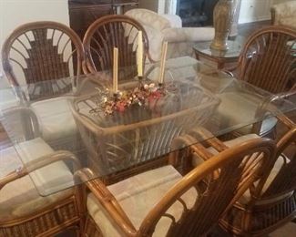 Rattan table, (5' x 42" )  6 chairs,   Priced at $250